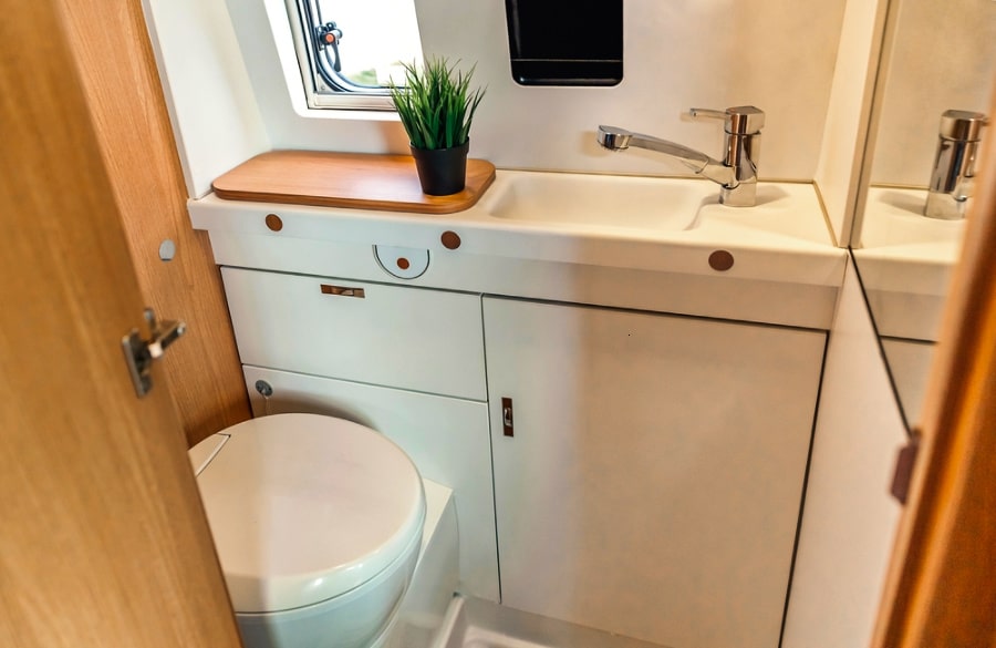 View of the small space toilet area inside the camper van