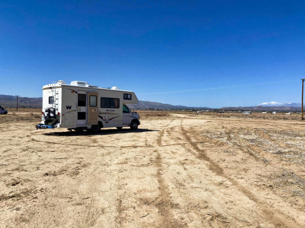 A camper van parked in the middle of the campsite in Joshua Tree