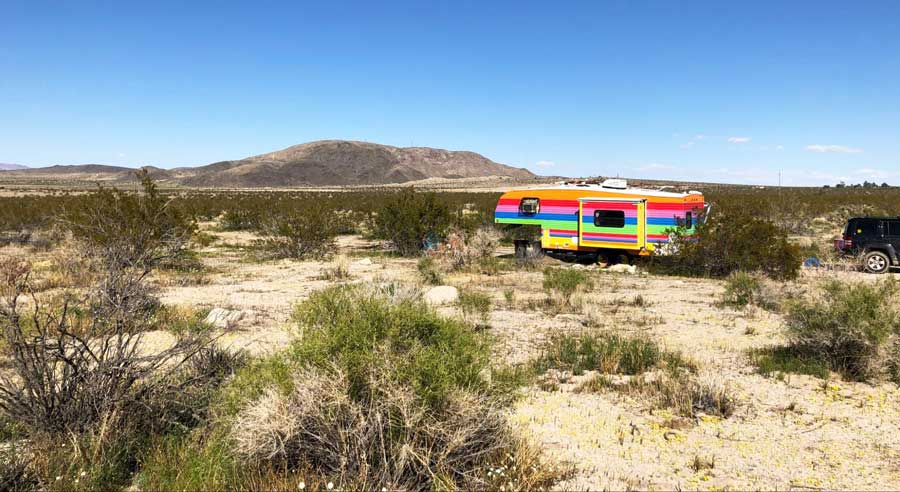 View of a colorful travel trailer in Joshua Tree