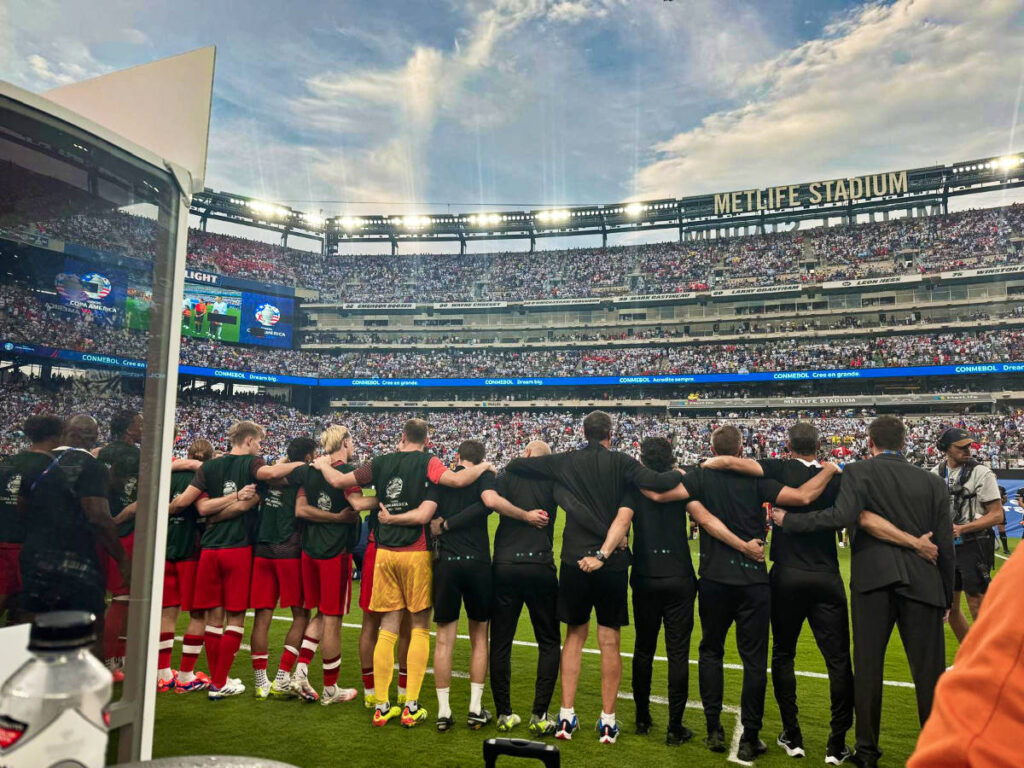 The Canadian team and coaches lining up in front of the packed Metlife Stadium