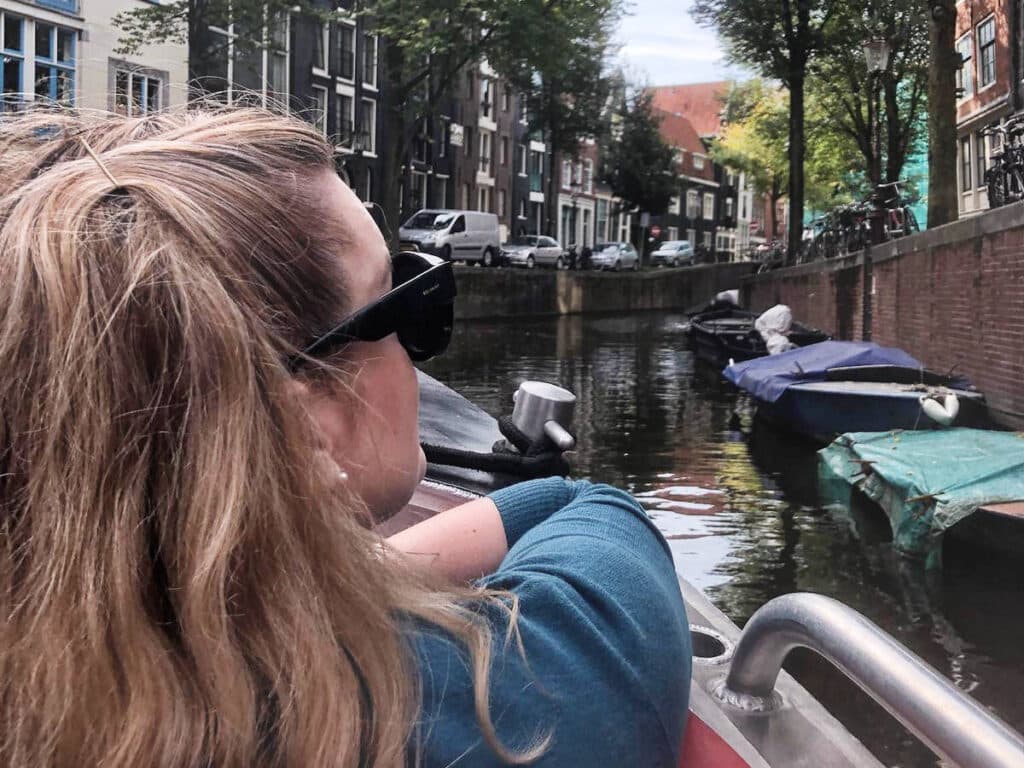 The author, Rachel Kapelke-Dale enjoying her day during a canal tour in Amsterdam