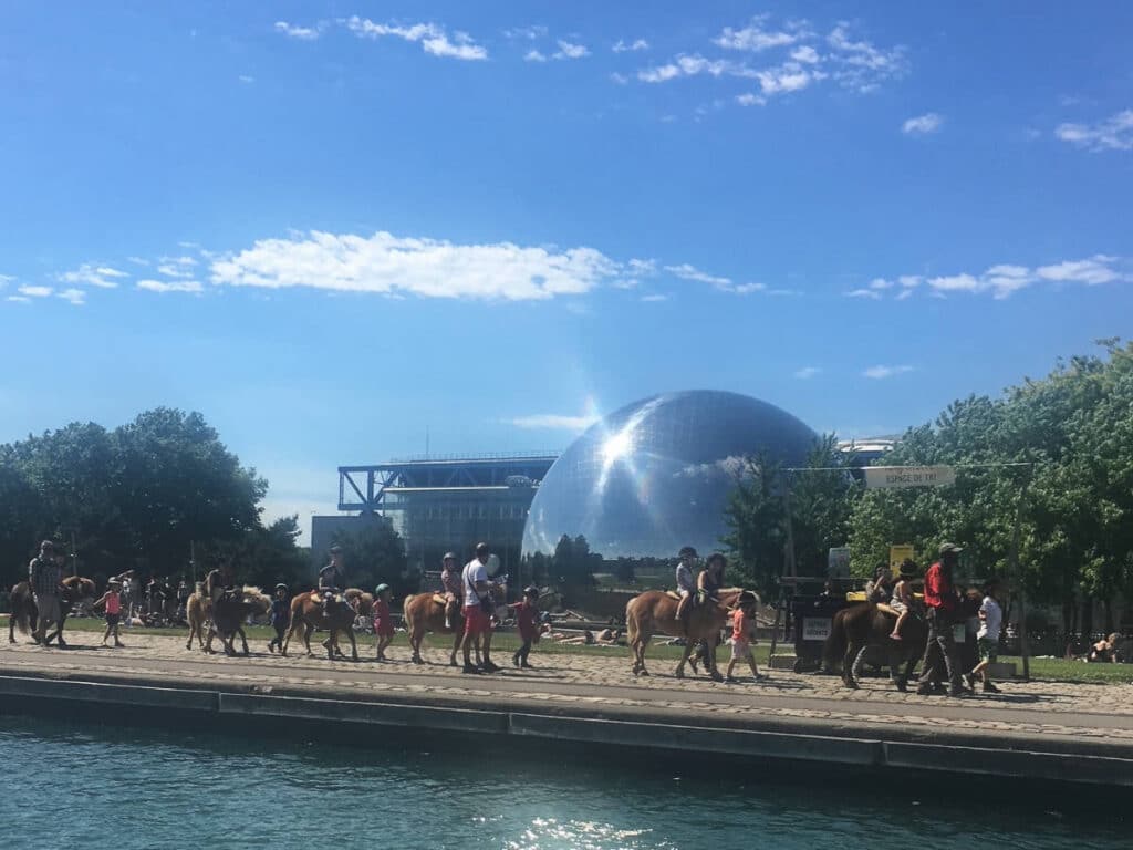People riding horses at the La Villette Park