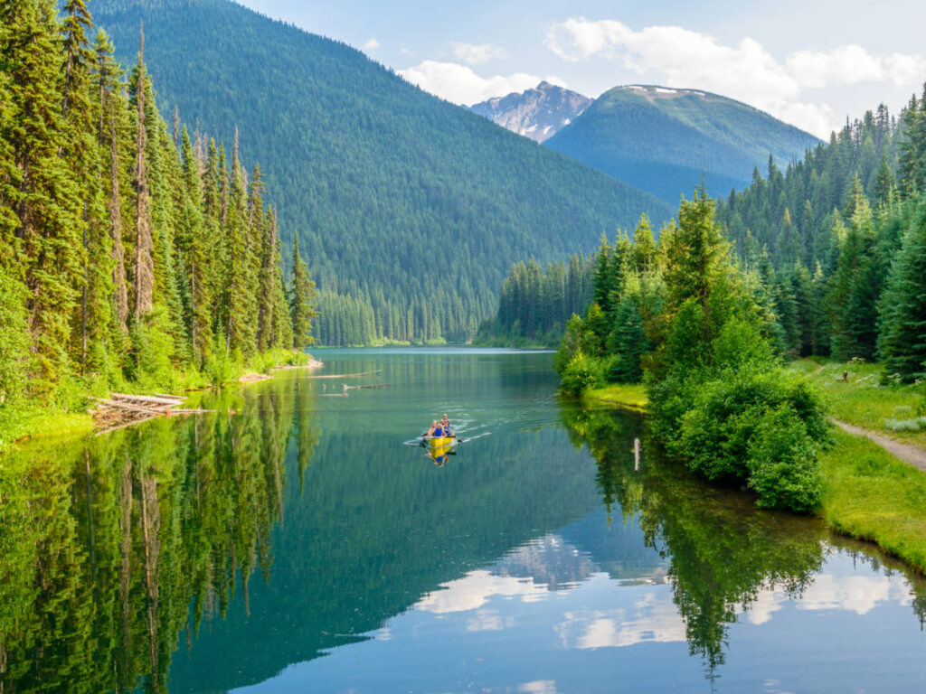 People canoeing on the mountain lake in E.C. Manning Park