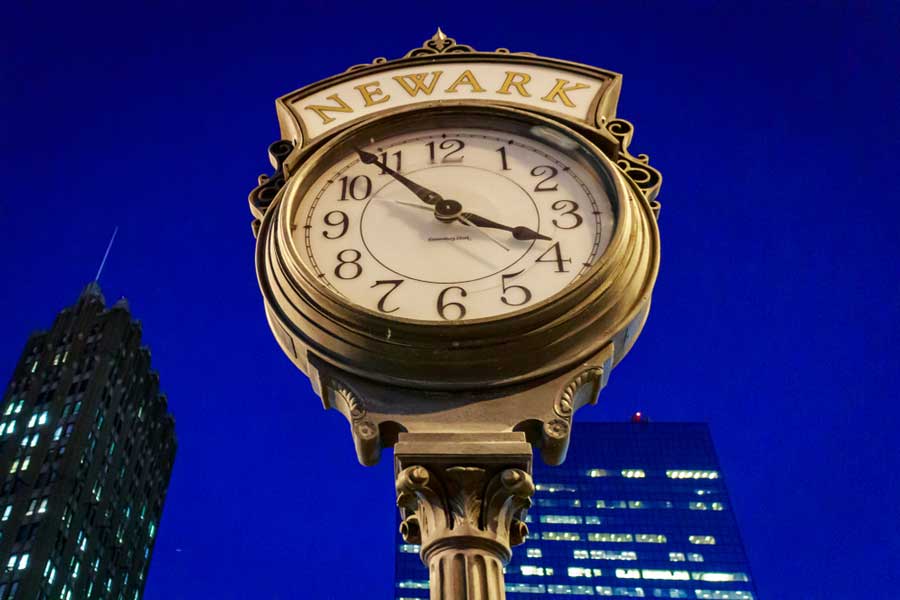 View of the Canterbury Clock Downtown Newark and the dark blue sky over it