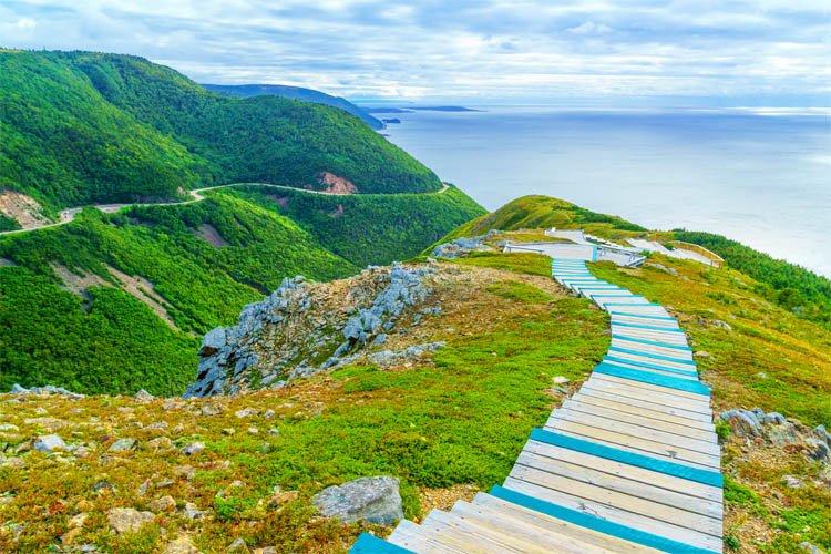A boardwalk winds down a coastal section of the Cabot Trail in Nova Scotia