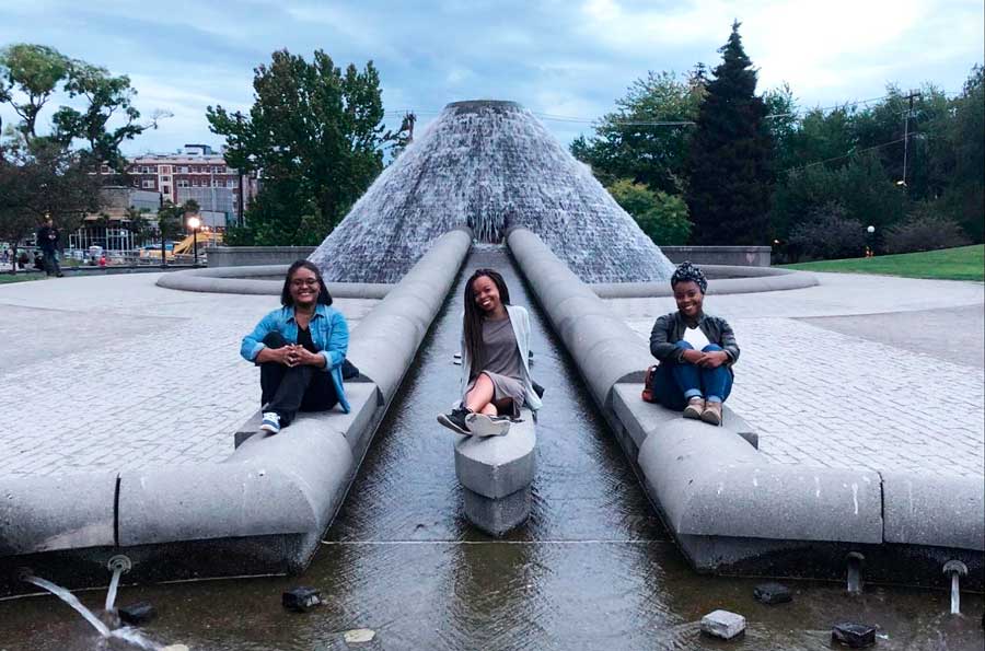 The author with her mom and sister on the fountain in Cal Anderson Park
