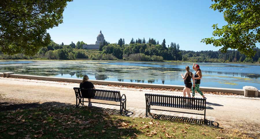 People enjoying their day around the Capitol Lake