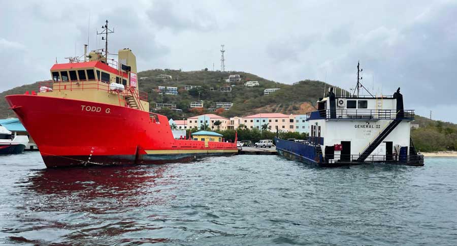 View of a red car barge parked on the water of USVI