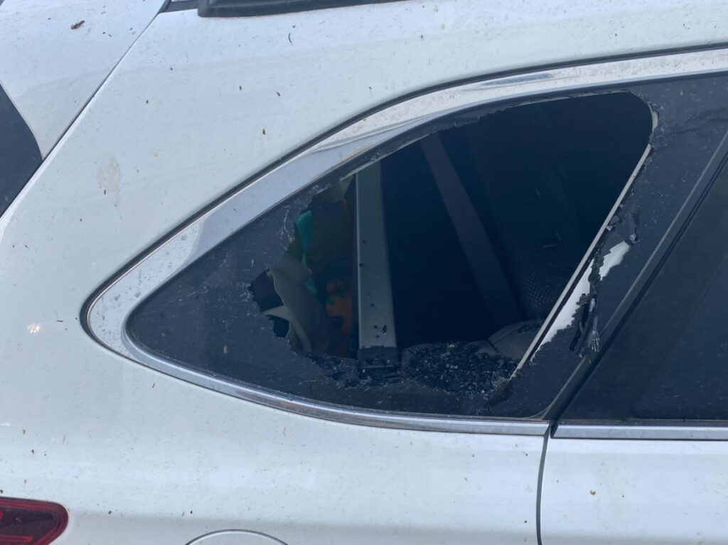 The author's friend's car with broken windows