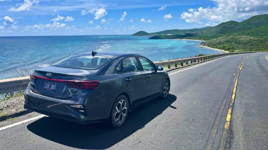 A car driving on the left side of the road