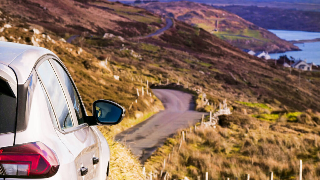 A car with a scenic view at the road