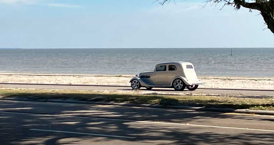 A car with the Mississippi Gulf Coast on the background