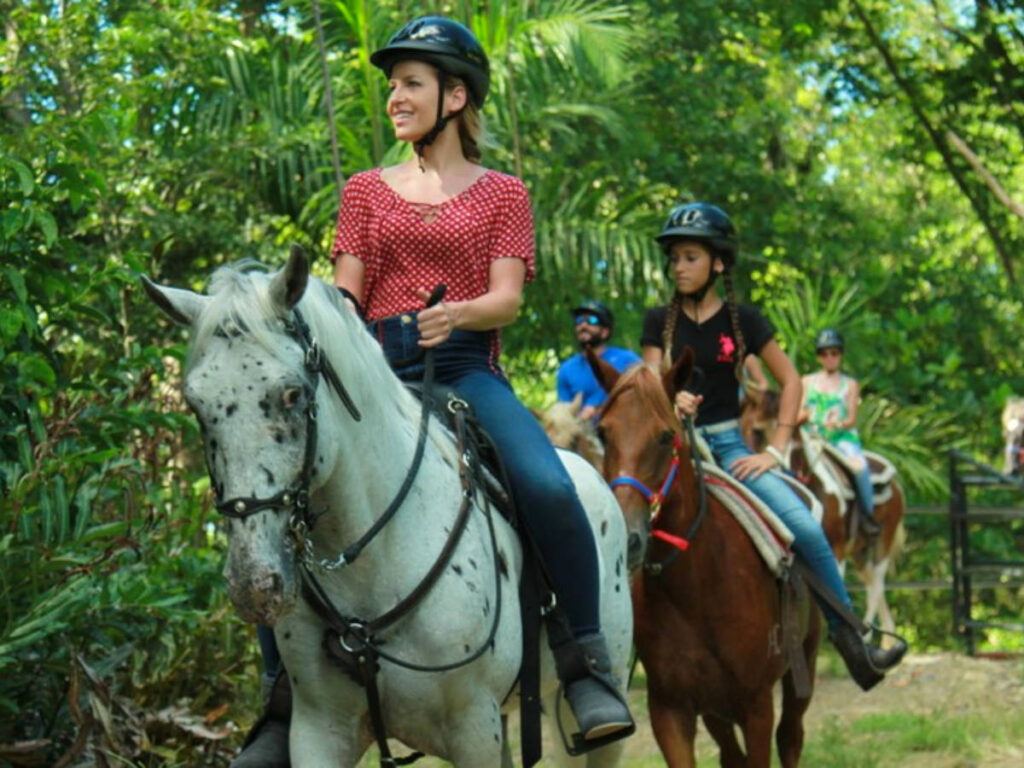 People riding horses at Carabalí Adventure Rainforest Park