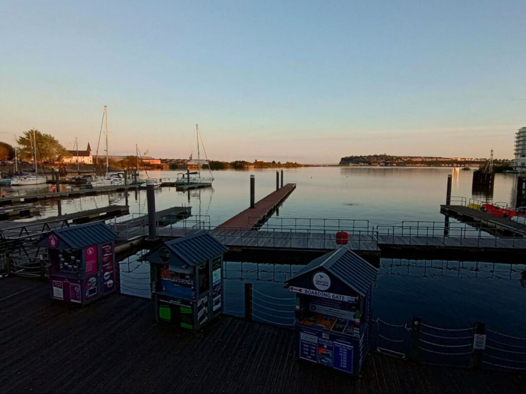 A serene view of Cardiff Bay at sunset