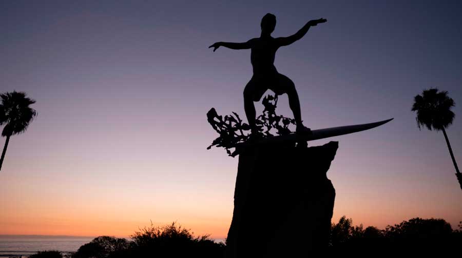 Silhouette of the Cardiff Kook Statue during sunset