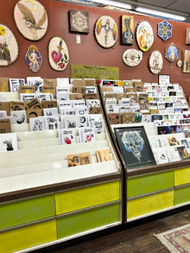 The cards displayed on the shelves at Manny’s Art Supplies