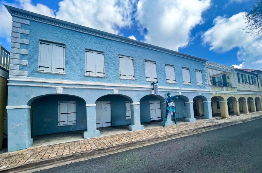 A light blue façade of the Caribbean Museum Center in Frederiksted
