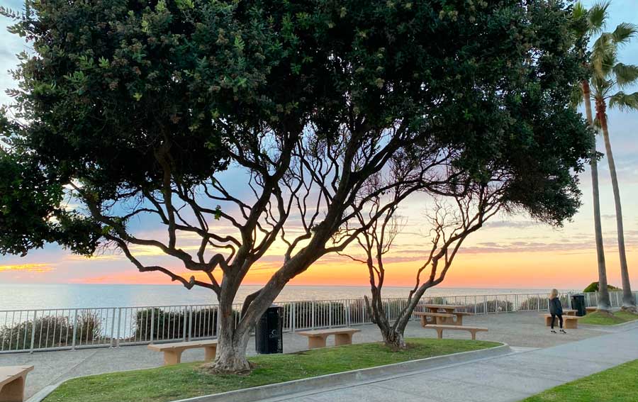 Scenic view of the sunset in Carlsbad Beach Boardwalk and Seawall
