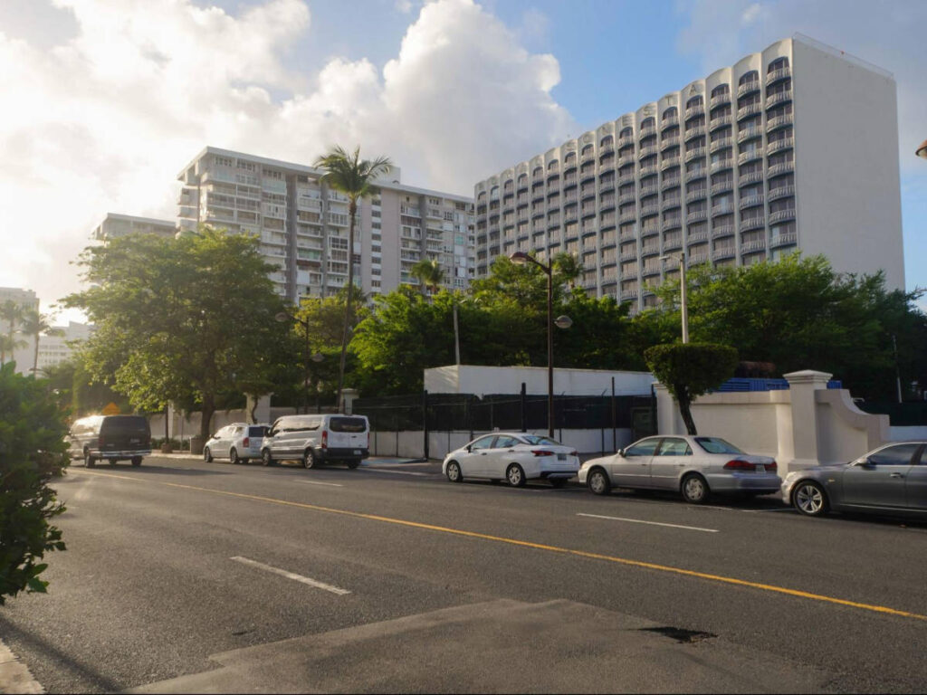 View of the cars parked along the street in Isla Verde