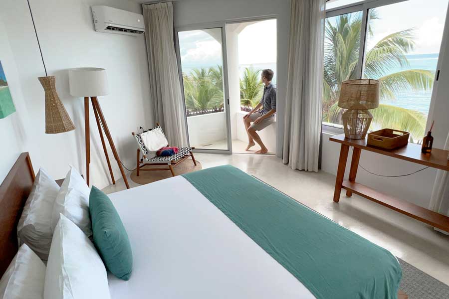 Nate at the balcony of a bedroom in Casa Altamar