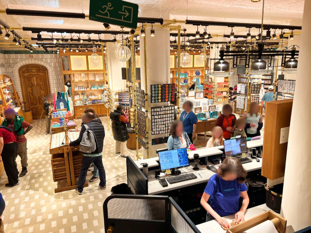 People wandering inside the gift shop in Casa Batllo