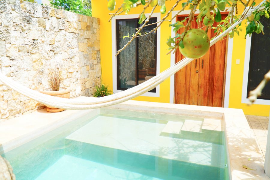 View of the hammock hanging over the pool area of Casa Hipil