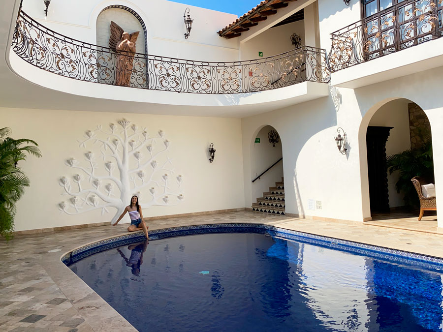 Clara in a pool in Casa Kimberly