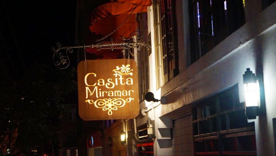 View of the Casita Miramar sign illuminated with lights at night