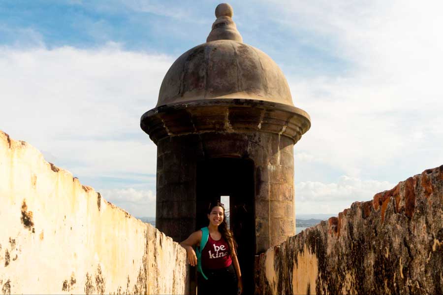 The author in Castillo San Felipe del Morro and the clear blue sky over it