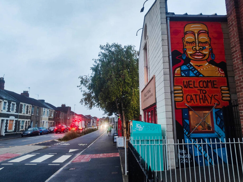 View of the street and the mural at the Cathays Community Centre