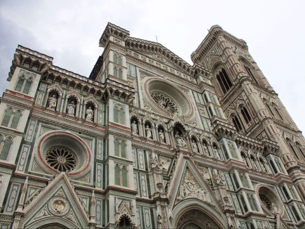 View of the towering Cathedral of Santa Maria del Fiore from the bottom in Piazza Del Duomo