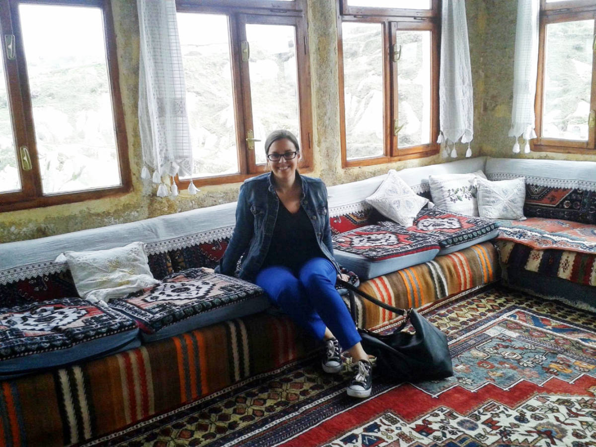 Travel Lemming author Catherine Driver sitting in a Turkish living room