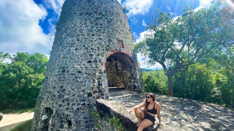 A woman posing near the ruins of Catherineberg in the US Virgin Islands