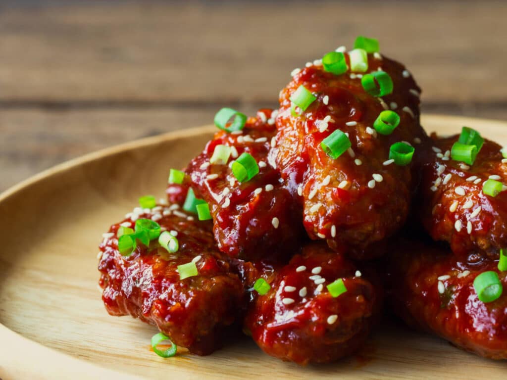 Korean style chicken wings on a plate served in Cellar 335