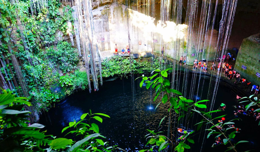 View of tourists in Cenote Ik Kil