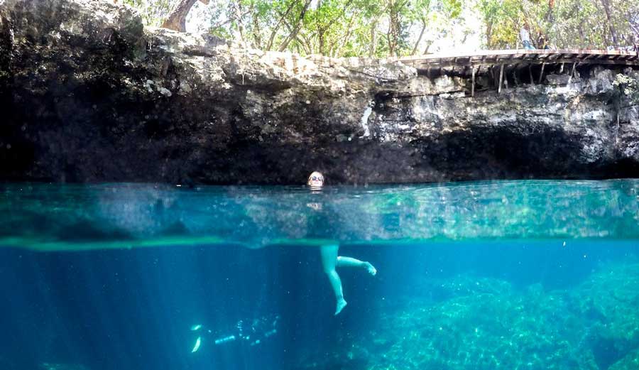 The author enjoying her day in a Cenotes in Playa del Carmen
