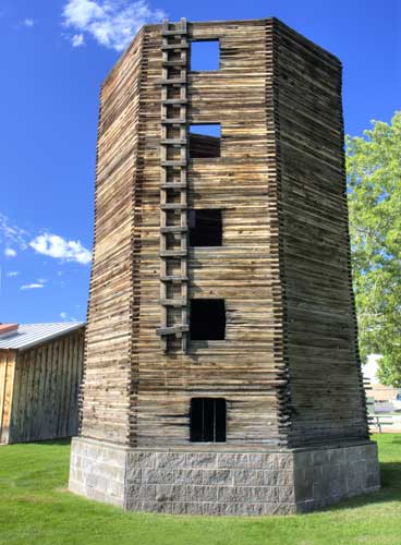 A vintage wood silo with ladder in Centennial Village Museum