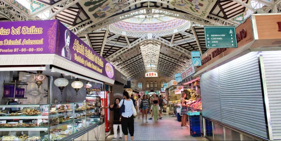 View of the food stalls inside the famous Central Market of Valencia.