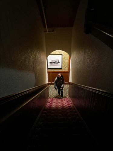 The author Chelsea, ready to ascend the dark staircase