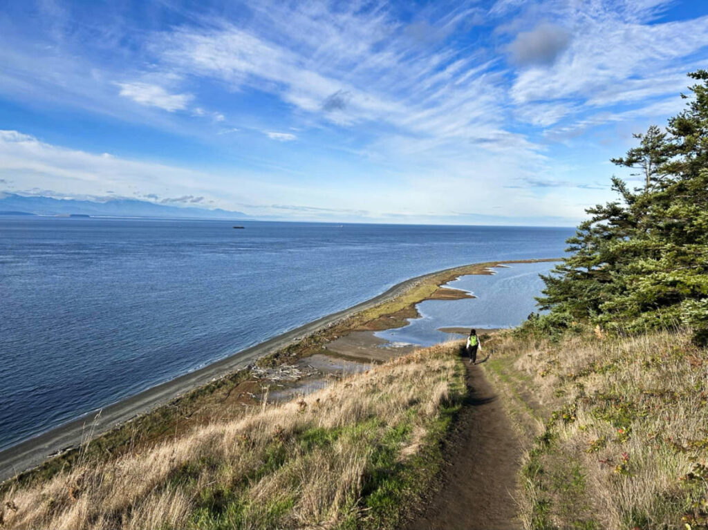 The author Chelsea Booker, hiking at the Ebey’s Landing bluff trail on Whidbey Island