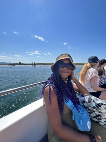 Chelsea Booker wearing a sunhat and sunglasses during summer