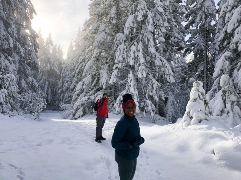 The author, Chelsea Booker with her husband during their snowy hike at winter season