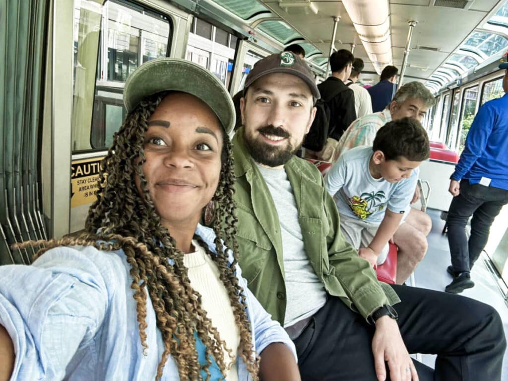 The author Chelsea Booker and her husband, taking the monorail from downtown Seattle