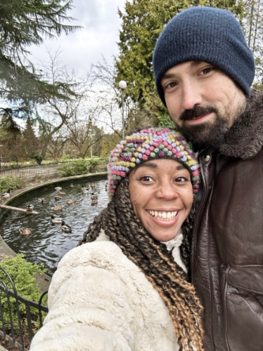 The author Chelsea Booker and her husband, posing near the duck pond in Volunteer Park