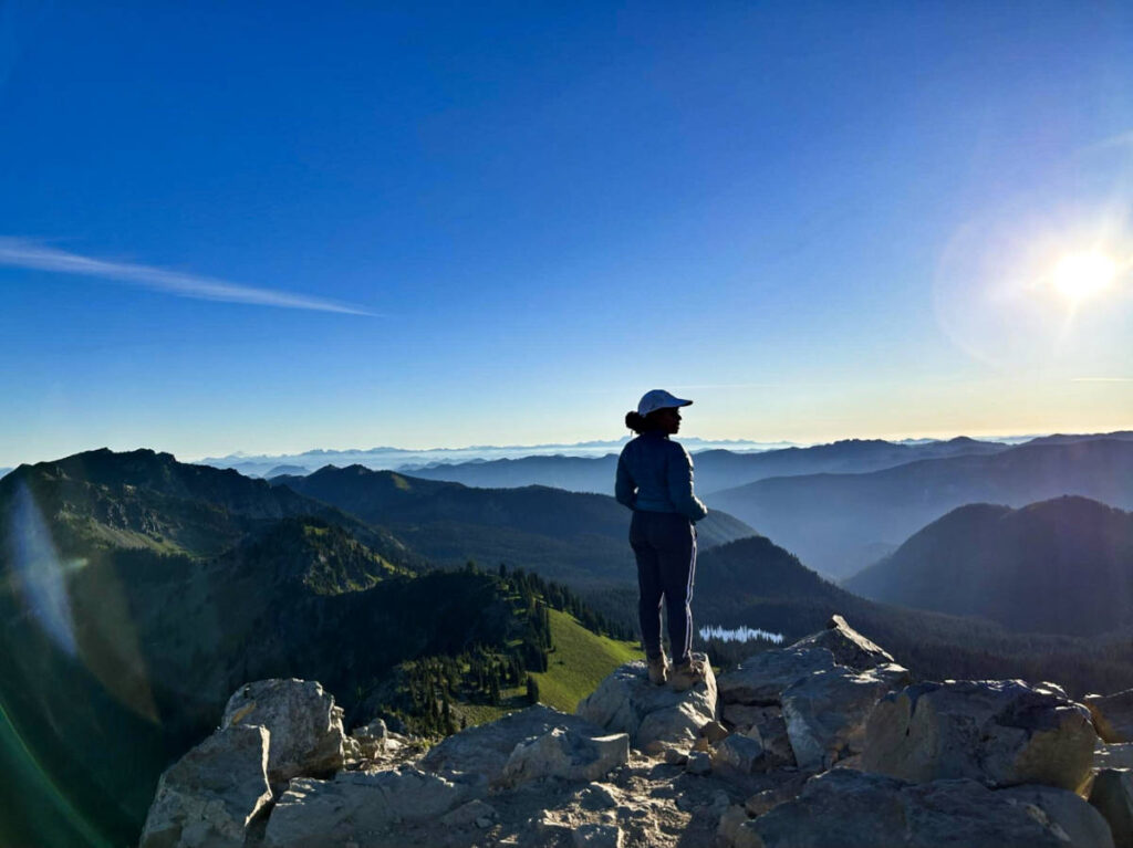 The author Chelsea Booker, admiring the view from the summit of Dege Peak