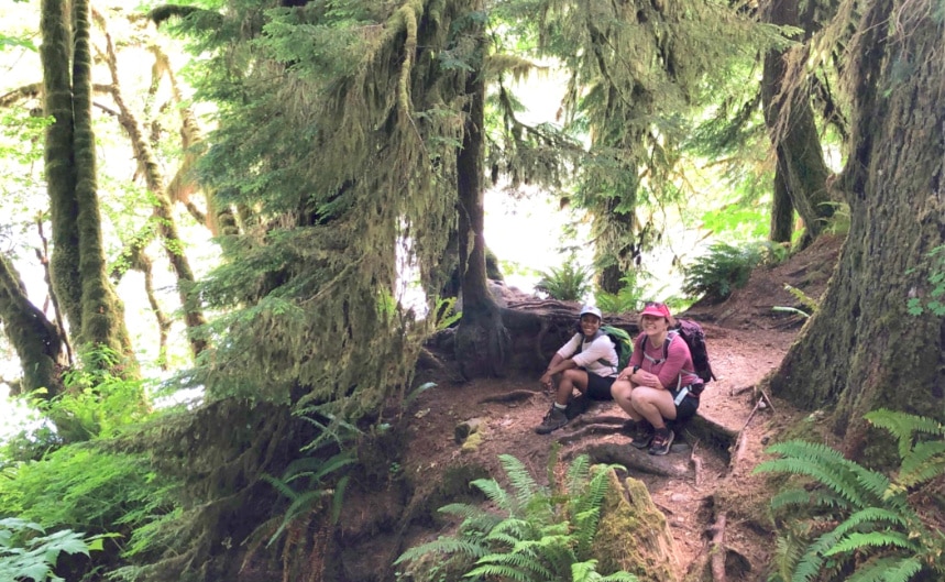 The author and a friend among trees in Olympic National Park