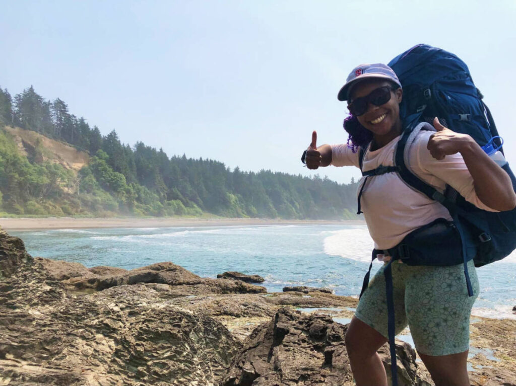 Travel Lemming edito, Chelsea Booker posing for a photo in Olympic National Park