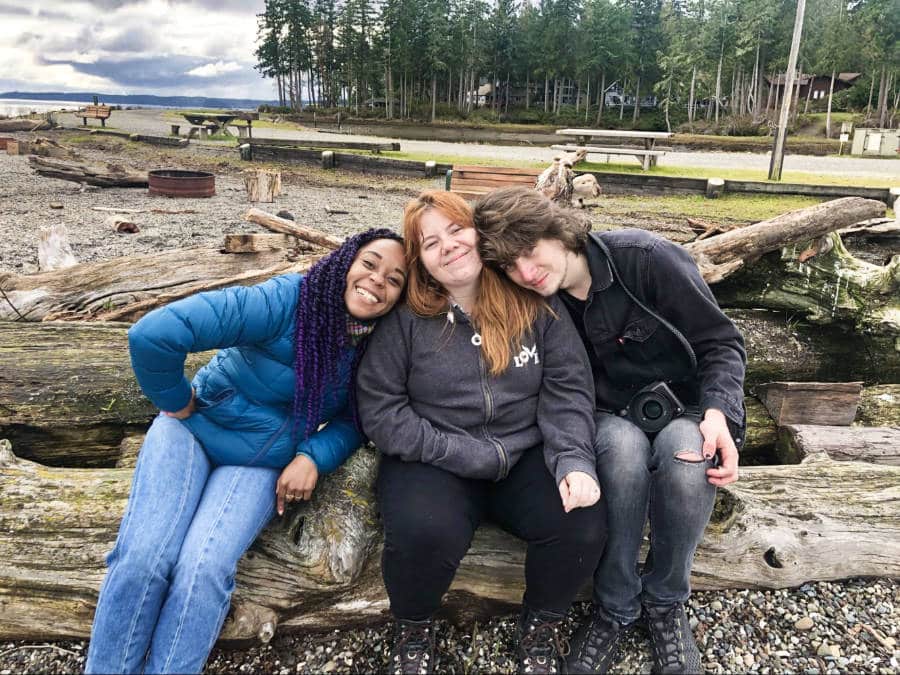 The author Chelsea Booker with her friends posing at Harstine Island