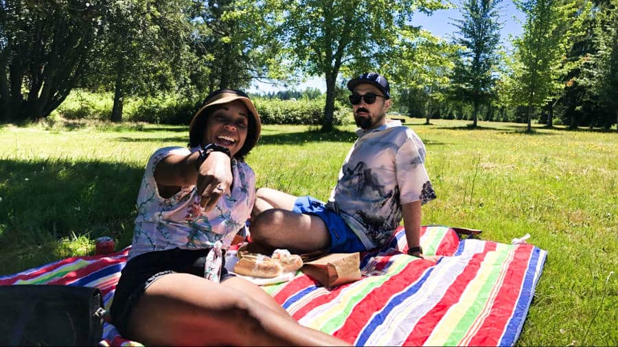 The author Chelsea Booker and her husband having a picnic in Battle Point Park