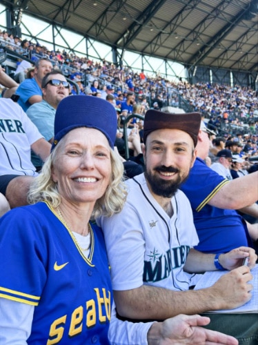 The author Chelsea Booker's husband and mother-in-law at the T-Mobile Park 